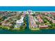 Beautiful aerial view of waterfront condos with private boat slips and gulf beaches nearby at 1300 N Portofino Dr # 103, Sarasota, FL 34242