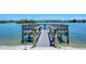 Private boat dock providing direct access to the waterway for boating and water activities at 1300 N Portofino Dr # 103, Sarasota, FL 34242