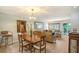 Bright living and dining area features wood-look floors, stylish lighting, and comfortable seating at 1300 N Portofino Dr # 103, Sarasota, FL 34242