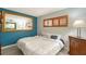 Bedroom with a plush bed, stylish decor, and natural light from the window at 1300 N Portofino Dr # 103, Sarasota, FL 34242