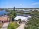 Expansive aerial view of a waterfront community with lush landscaping, showcasing its serene and desirable location at 1461 Marlin St, Nokomis, FL 34275