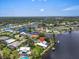 Stunning waterfront property featuring a private dock, lush landscaping, and beautiful canal views in a desirable neighborhood at 1461 Marlin St, Nokomis, FL 34275
