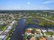 Amazing waterfront property featuring serene canal views, complemented by lush landscaping and easy access to waterways at 1461 Marlin St, Nokomis, FL 34275