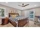 Cozy bedroom with a queen-sized bed, adjacent to an outdoor pool area, providing a relaxing space at 1461 Marlin St, Nokomis, FL 34275