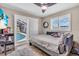 Bedroom with neutral tones, wood floors, and a sliding door access to the pool at 1461 Marlin St, Nokomis, FL 34275
