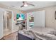 Comfortable bedroom with a view of the pool, featuring tiled floor and neutral colored walls at 1461 Marlin St, Nokomis, FL 34275