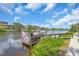 Scenic waterfront view of a private boat dock on a sunny day, with boats and waterfront residences at 1461 Marlin St, Nokomis, FL 34275