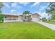Beautiful one-story home with well-manicured lawn and lush landscaping in a desirable neighborhood at 1461 Marlin St, Nokomis, FL 34275