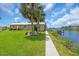 Charming waterfront residence boasting lush landscaping, a private dock, and a tranquil setting for relaxation at 1461 Marlin St, Nokomis, FL 34275