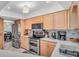 Kitchen with stainless steel appliances, and light wood cabinets at 1461 Marlin St, Nokomis, FL 34275