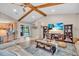 Cozy living room offers pool views, open kitchen access and comfortable seating for entertaining guests at 1461 Marlin St, Nokomis, FL 34275