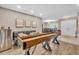 Open concept space featuring a shuffleboard table with easy access to seating and nearby dining area at 1461 Marlin St, Nokomis, FL 34275