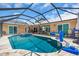 Spacious screened-in pool and spa with outdoor seating and entertainment areas at 1461 Marlin St, Nokomis, FL 34275
