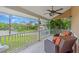 Cozy porch provides seating and views of the outdoors, with a ceiling fan for added comfort at 1461 Marlin St, Nokomis, FL 34275