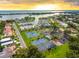 Upscale community featuring tennis courts, lush landscaping, marina, and waterfront homes at 1484 Seafarer Dr, Osprey, FL 34229
