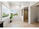 Bright bathroom area with large window view, cabinet with granite countertop, and access to shower at 1484 Seafarer Dr, Osprey, FL 34229