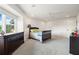 Bedroom featuring a twin bed and natural light filtering through the window, complemented by a dresser and cozy ambiance at 1484 Seafarer Dr, Osprey, FL 34229