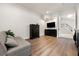Bedroom with hard wood floors, sitting area, and stairway in the background at 1484 Seafarer Dr, Osprey, FL 34229