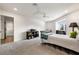 Comfortable bedroom features a twin bed, gray carpet, and natural light creating a serene space at 1484 Seafarer Dr, Osprey, FL 34229