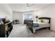 Comfortable bedroom features a twin bed, gray carpet, and natural light creating a serene space at 1484 Seafarer Dr, Osprey, FL 34229