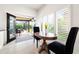 Cozy breakfast nook with table and chairs, plus sliding door access to screened lanai at 1484 Seafarer Dr, Osprey, FL 34229
