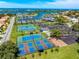Aerial view of community amenity with tennis and pickleball courts, playground, and bay access at 1484 Seafarer Dr, Osprey, FL 34229