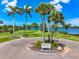 Scenic view of a community park with lush landscaping and waterfront access at 1484 Seafarer Dr, Osprey, FL 34229