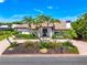 Gorgeous home featuring a meticulously landscaped yard and a charming front entrance at 1484 Seafarer Dr, Osprey, FL 34229