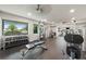 Modern gym with weightlifting equipment and machines overlooking beautiful exterior scenery at 1484 Seafarer Dr, Osprey, FL 34229