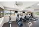 Modern gym with state-of-the-art cardio machines with a beautiful exterior harbor view at 1484 Seafarer Dr, Osprey, FL 34229