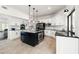 Bright kitchen featuring a large center island, white cabinetry, and modern appliances at 1484 Seafarer Dr, Osprey, FL 34229