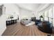 Bright and open living space with large windows, a cozy fireplace, and stylish decor, perfect for relaxation at 1484 Seafarer Dr, Osprey, FL 34229