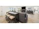 Open living room featuring a fireplace, comfortable seating, and a bar area at 1484 Seafarer Dr, Osprey, FL 34229
