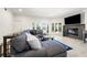 Bright living room with a large sectional sofa, fireplace, and views of the backyard at 1484 Seafarer Dr, Osprey, FL 34229