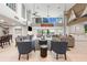 Grand lobby featuring soaring ceilings, comfortable seating, stylish decor, and water views through the glass doors at 1484 Seafarer Dr, Osprey, FL 34229