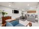 Comfortable lounge area with modern furniture, a large TV, stylish decor, and a relaxing atmosphere at 1484 Seafarer Dr, Osprey, FL 34229