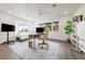 Bright office features a large window, modern desk, and neutral decor, with hardwood flooring creating a comfortable workspace at 1484 Seafarer Dr, Osprey, FL 34229