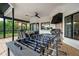 Outdoor patio features a dining table, barbecue, and foosball table for entertainment and leisure at 1484 Seafarer Dr, Osprey, FL 34229
