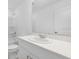 Clean bathroom with white vanity, sink, and a large mirror at 16652 Bergamo Pl, Bradenton, FL 34211