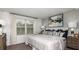 Inviting bedroom features a large window, plush bedding, and stylish decor at 16652 Bergamo Pl, Bradenton, FL 34211