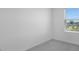 Neutral bedroom with a window offering natural light and outdoor views at 16652 Bergamo Pl, Bradenton, FL 34211
