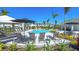 Resort style pool with lounge chairs and umbrellas in a luxurious community at 16652 Bergamo Pl, Bradenton, FL 34211