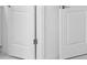 A close up view of two white doors with silver hardware and bright surroundings at 16652 Bergamo Pl, Bradenton, FL 34211