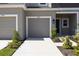 Exterior of a townhome with a one car garage, landscaping and neutral color palette at 16652 Bergamo Pl, Bradenton, FL 34211