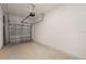 Clean garage with an automatic door, offering secure parking and storage options at 16652 Bergamo Pl, Bradenton, FL 34211
