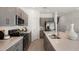 Beautiful kitchen featuring stainless steel appliances, granite countertops, and a center island with seating at 16652 Bergamo Pl, Bradenton, FL 34211