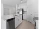 Contemporary kitchen with stainless steel appliances, white cabinets and an island at 16652 Bergamo Pl, Bradenton, FL 34211