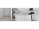 Stylish kitchen with an island, stainless steel appliances and white cabinets at 16652 Bergamo Pl, Bradenton, FL 34211