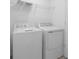 Convenient laundry room with modern, white washer and dryer units at 16652 Bergamo Pl, Bradenton, FL 34211