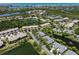 Aerial view highlighting the home's setting amidst a well-maintained residential area with water views at 1684 Pintail Way, Sarasota, FL 34231